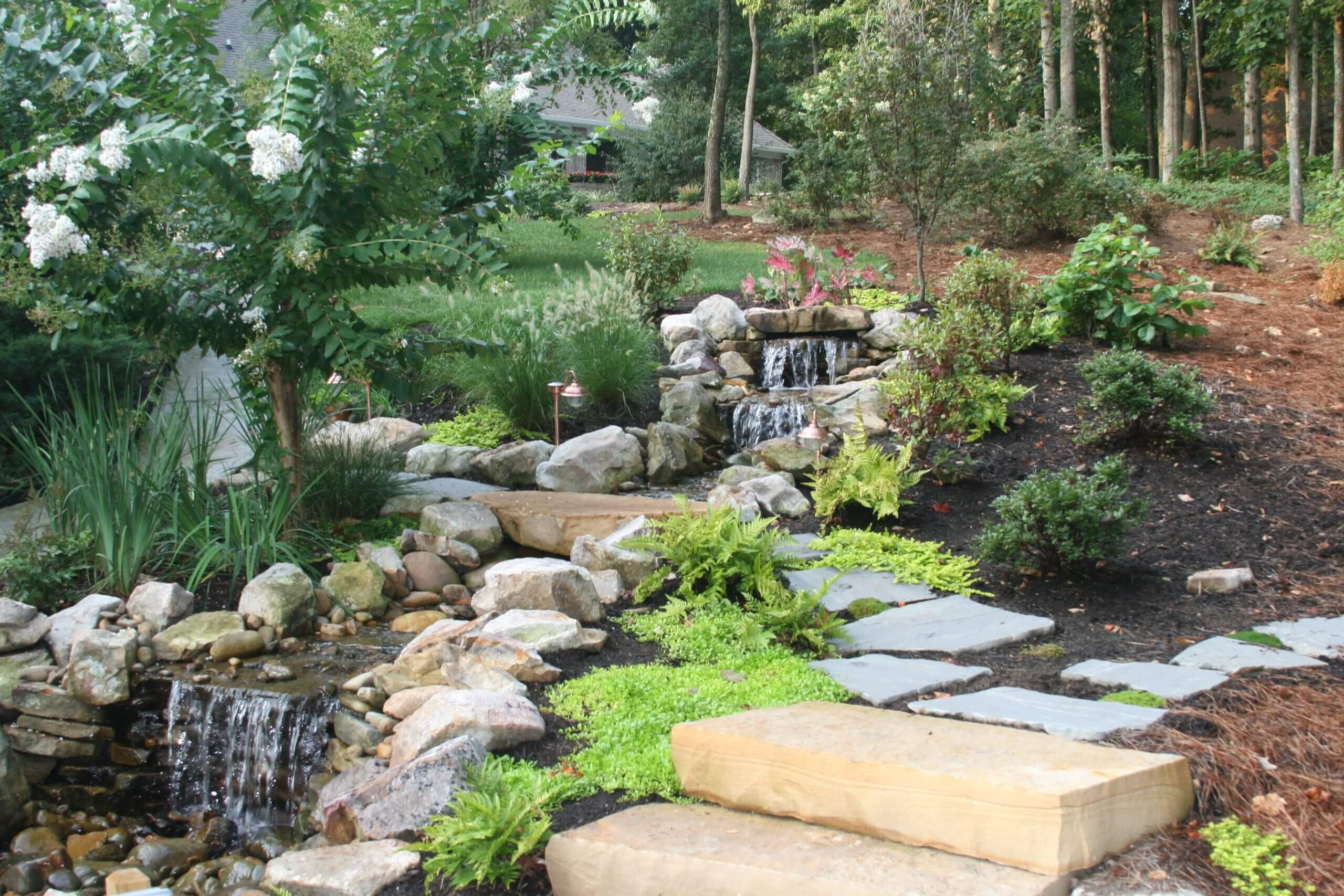 hardscapesPondless Waterfall with a Bubbling Rock feature & Natural Stone Steps among traditional Landscaping in Oak Ridge, Tennessee